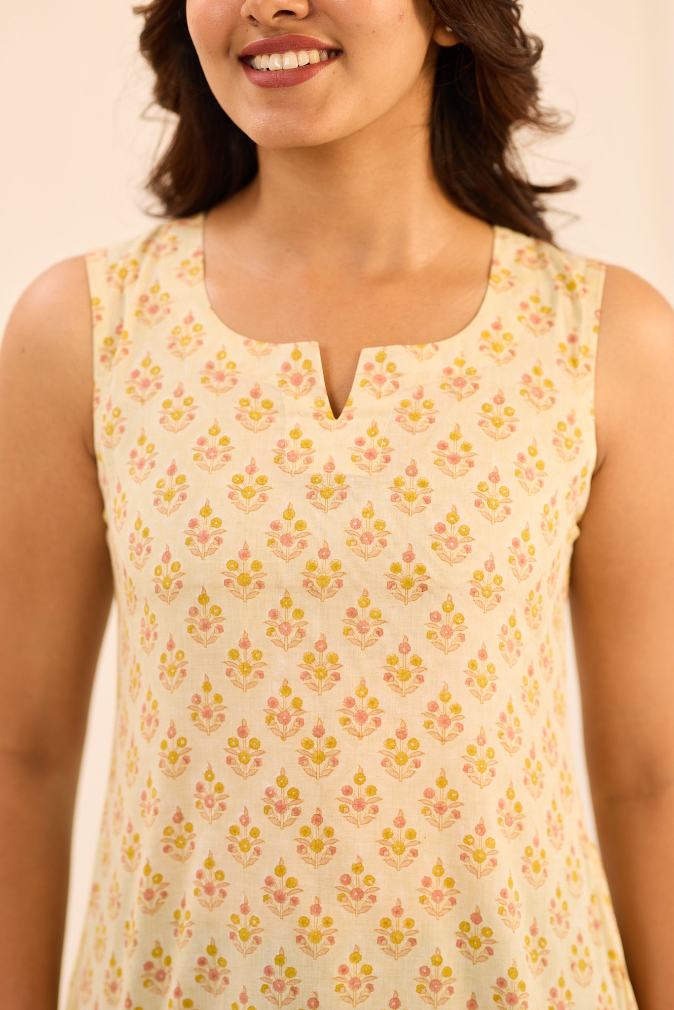 Light Ivory with Yellow Printed Sleeveless Cotton Short Kurti